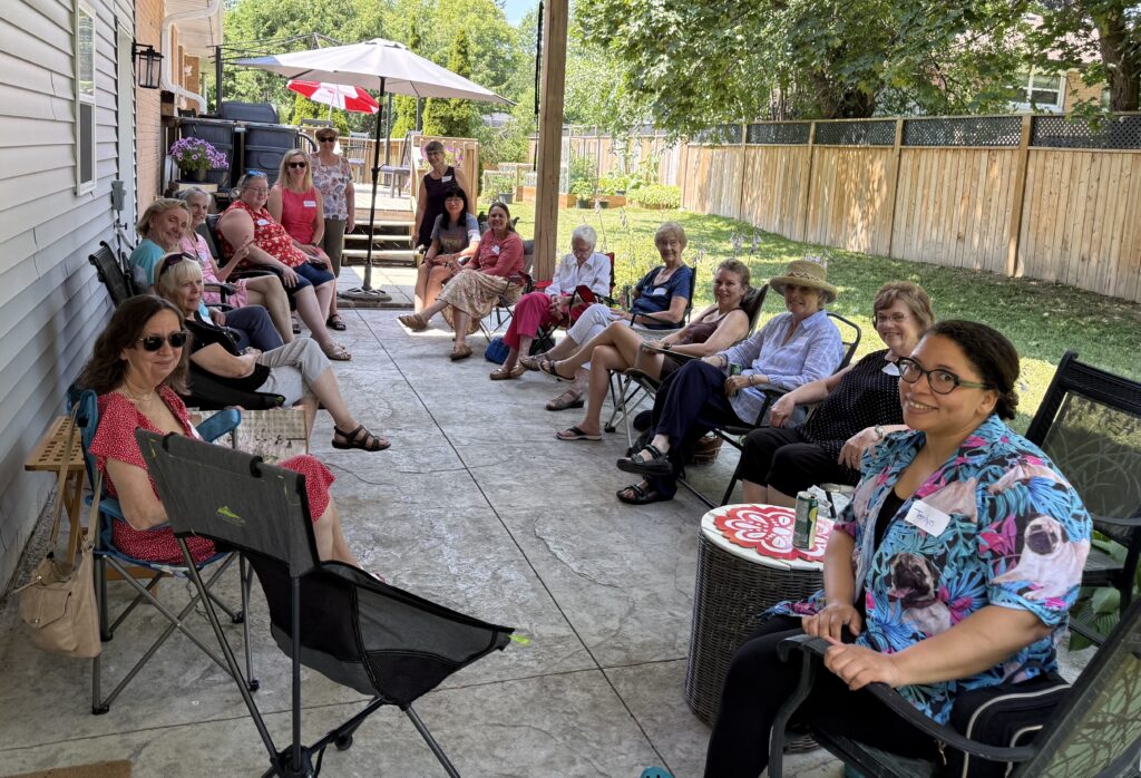 women gathered on patio for picnic lunch
